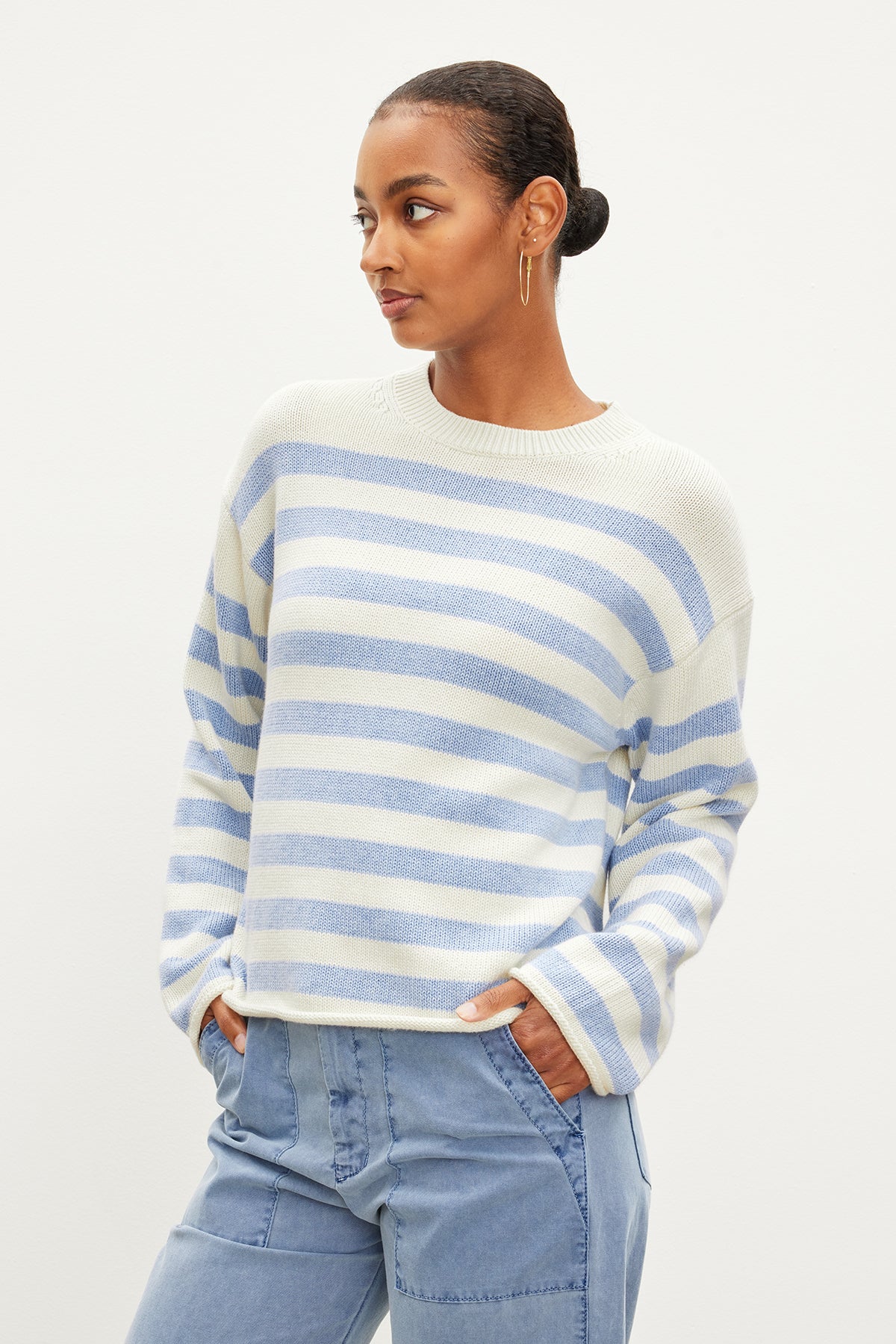 The model is wearing a Velvet by Graham & Spencer LEX STRIPED CREW NECK SWEATER.-35967621726401