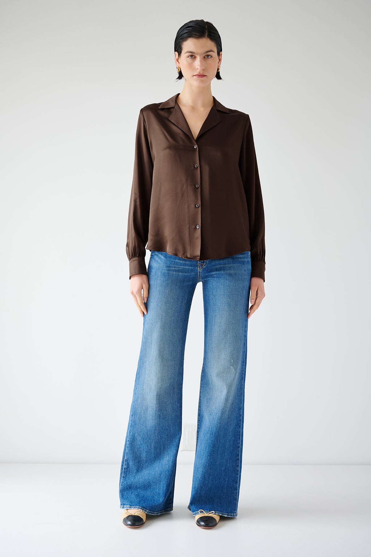 The model is wearing a timeless brown Silk Button-Up Blouse, the SOHO TOP by Velvet by Jenny Graham.-35547448770753