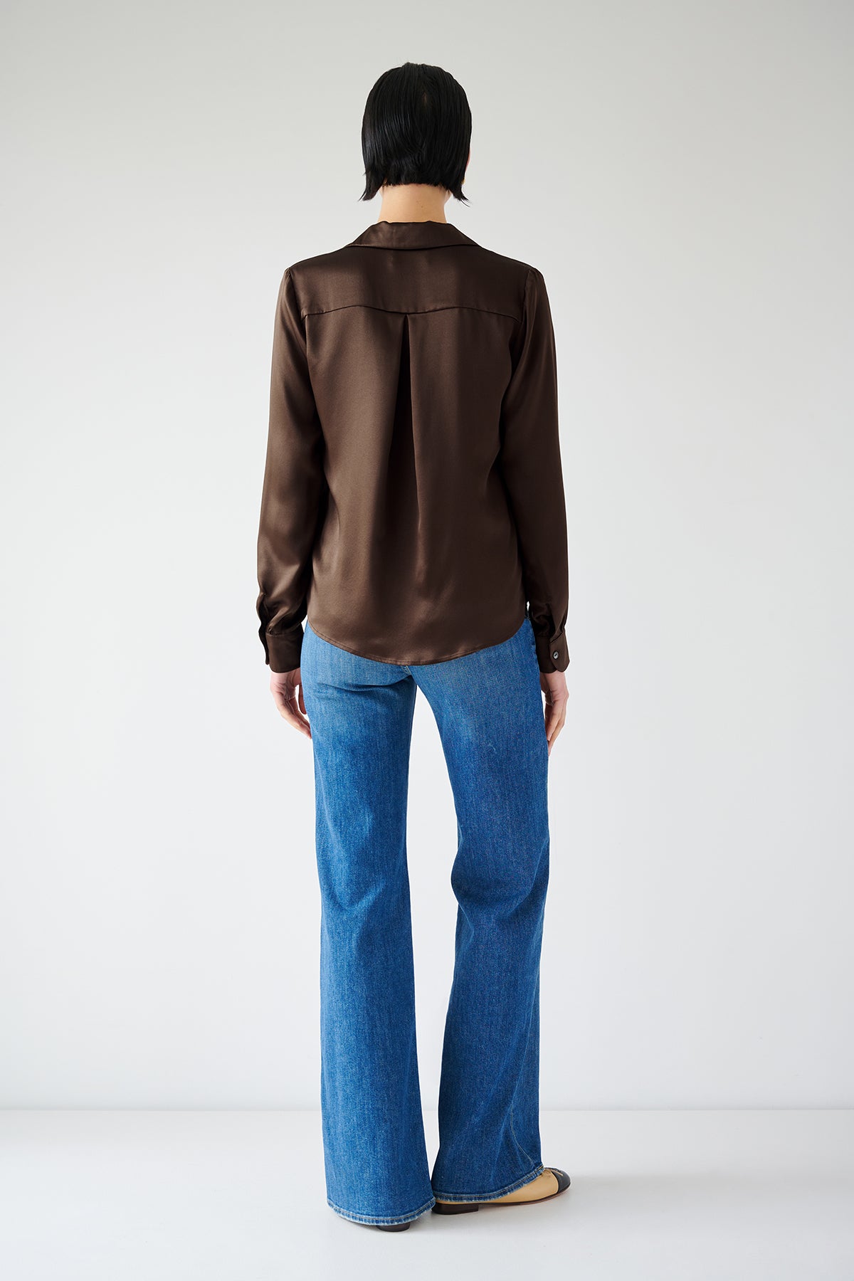   The timeless back view of a woman wearing a Velvet by Jenny Graham SOHO TOP in silk charmeuse. 