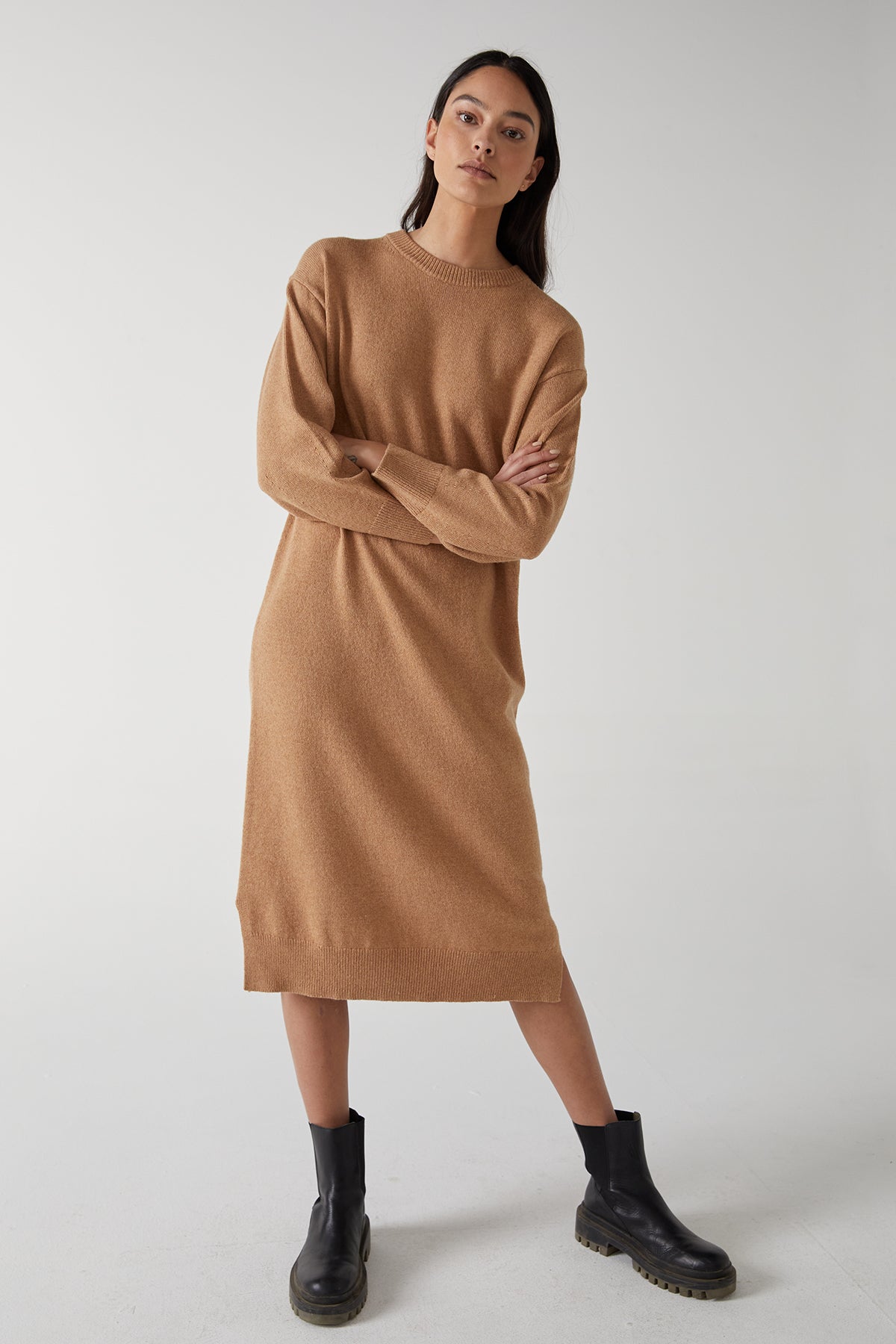 The model is wearing a Velvet by Jenny Graham LAUREL DRESS with side hem slits.-25315843735745