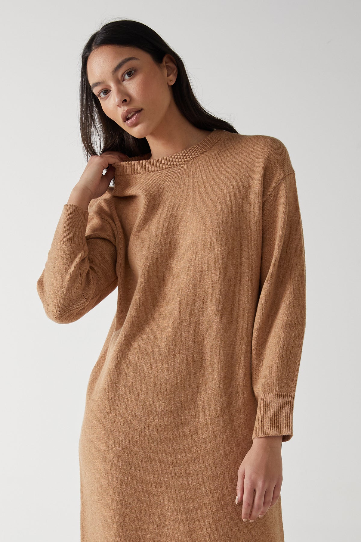 The model is showcasing a Velvet by Jenny Graham LAUREL DRESS, featuring side hem slits for a minimal silhouette.-25315843768513
